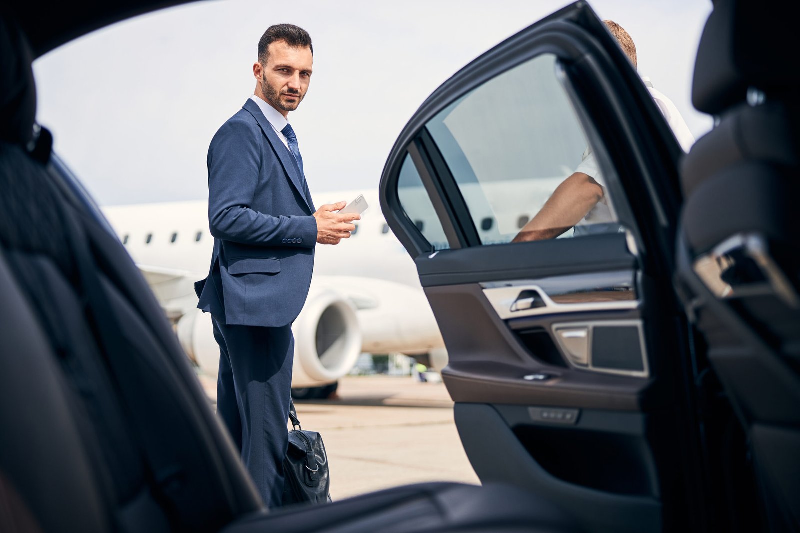 well dressed businessman arriving by plane and car 2026 01 05 22 56 31 utc 1 scaled